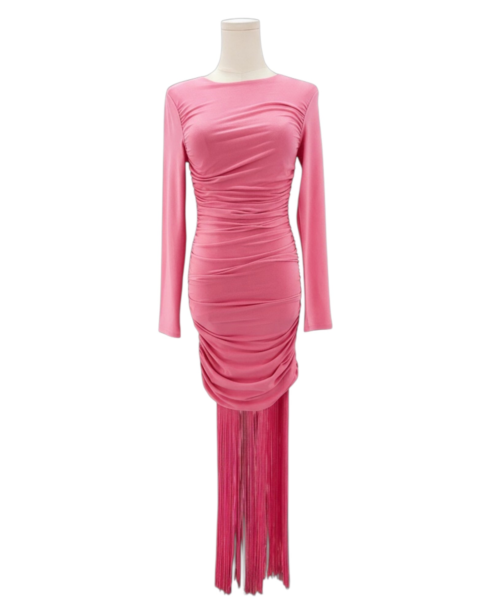 Pink dress with long sleeves and fringe details on a mannequin against a white background