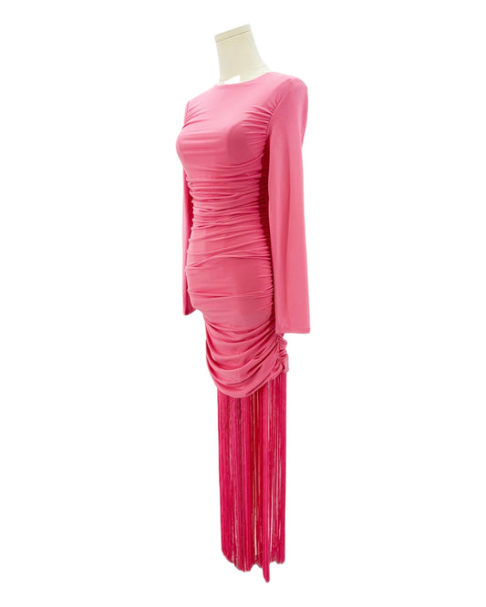 Pink long sleeve dress with fringe details on a mannequin against a white background