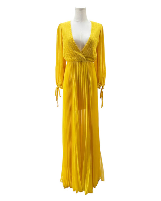 Yellow dress on a mannequin against a white background