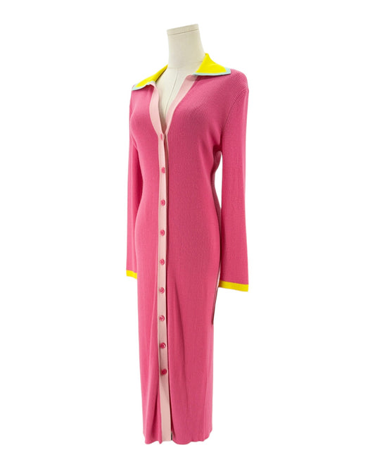 Pink ribbed long sleeve midi dress with yellow details on the collar and cuffs. On and white background on a mannequin
