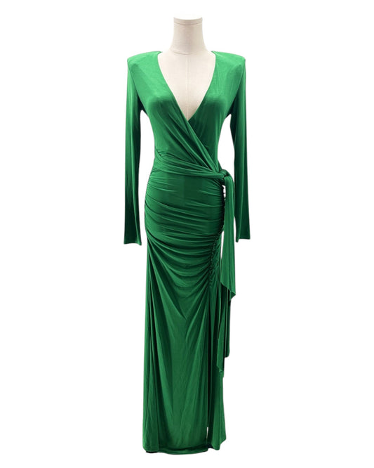 Green evening gown on a mannequin against a white background