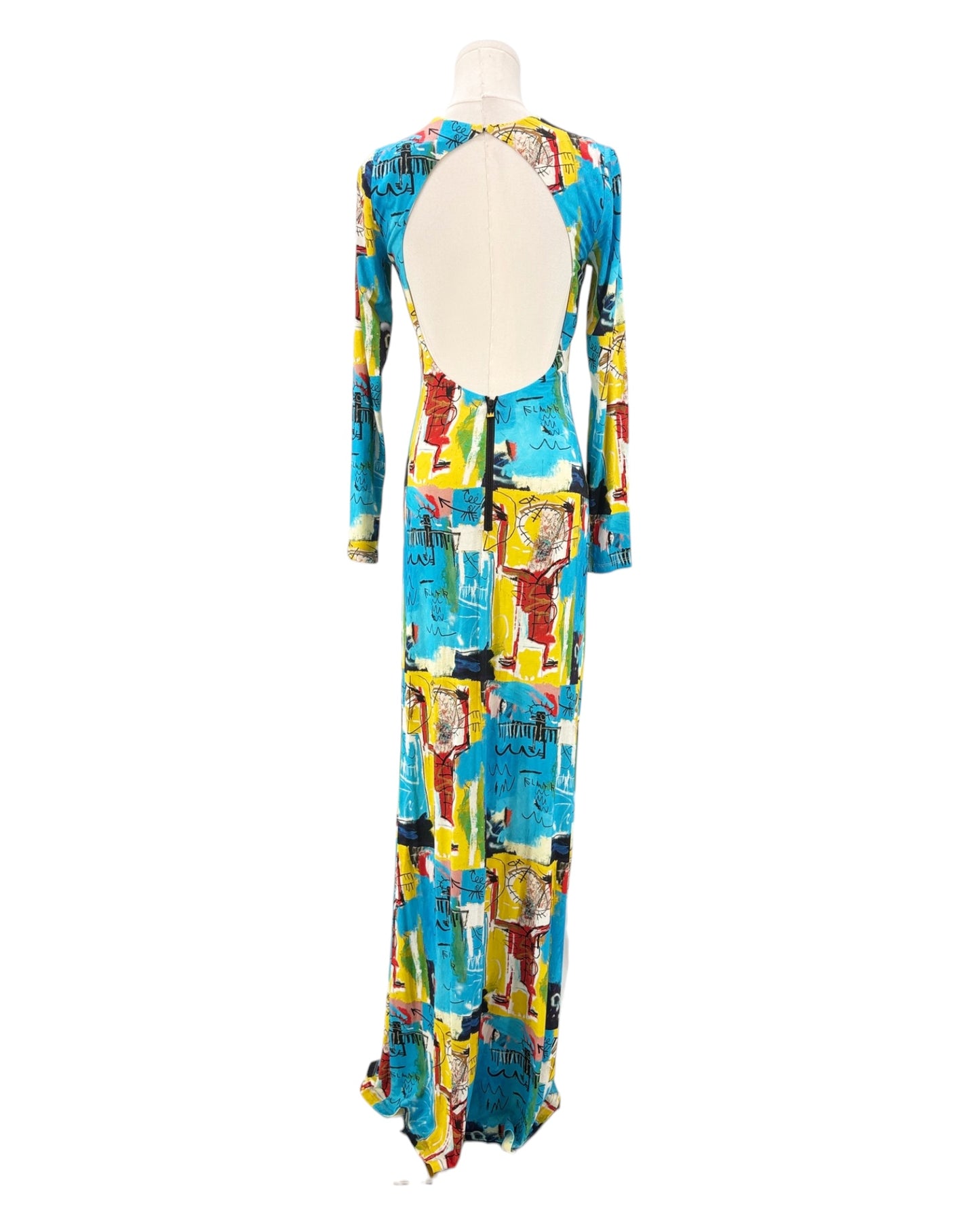 Colorful patterned dress on a mannequin against a white background