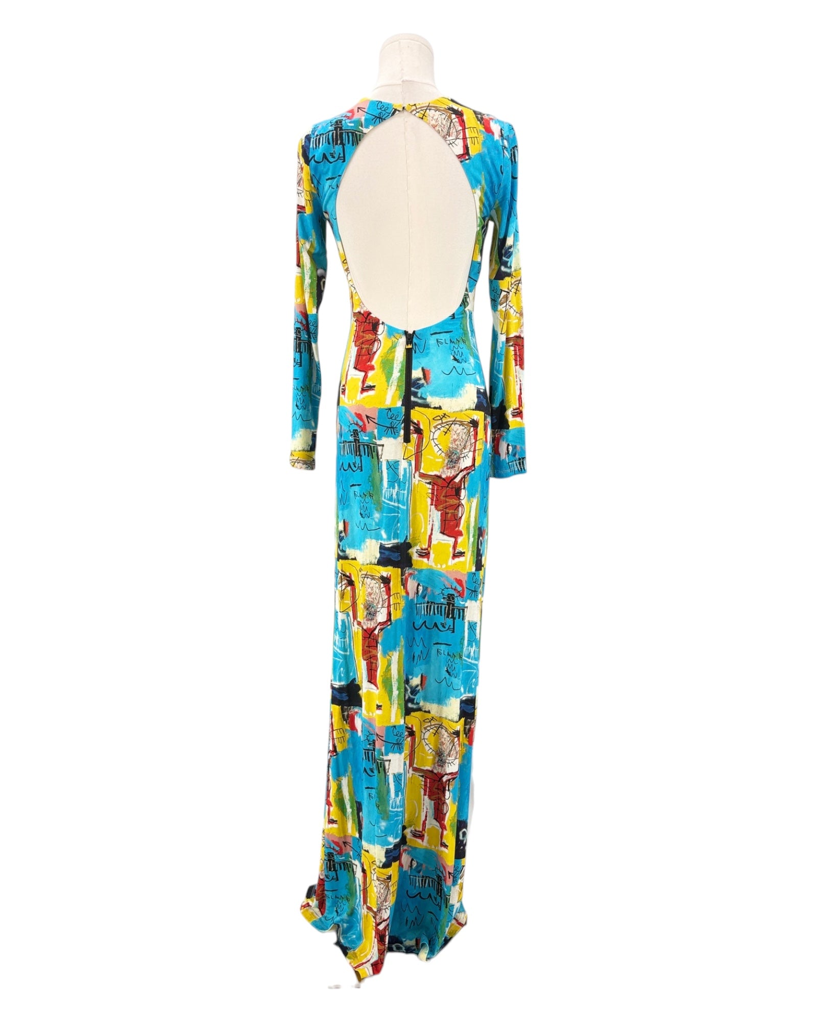 Colorful patterned dress on a mannequin against a white background
