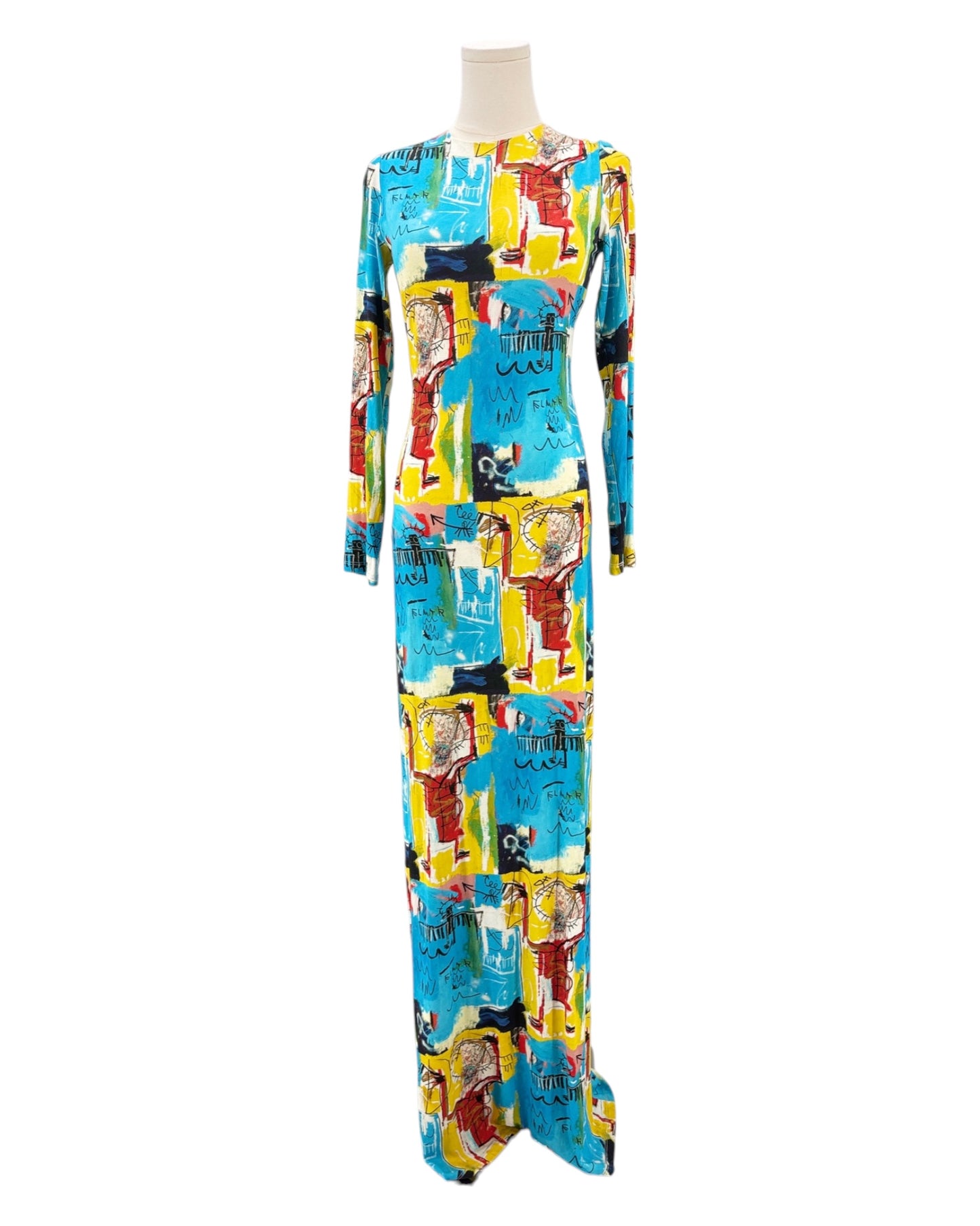 Colorful patterned dress on a mannequin against a white background