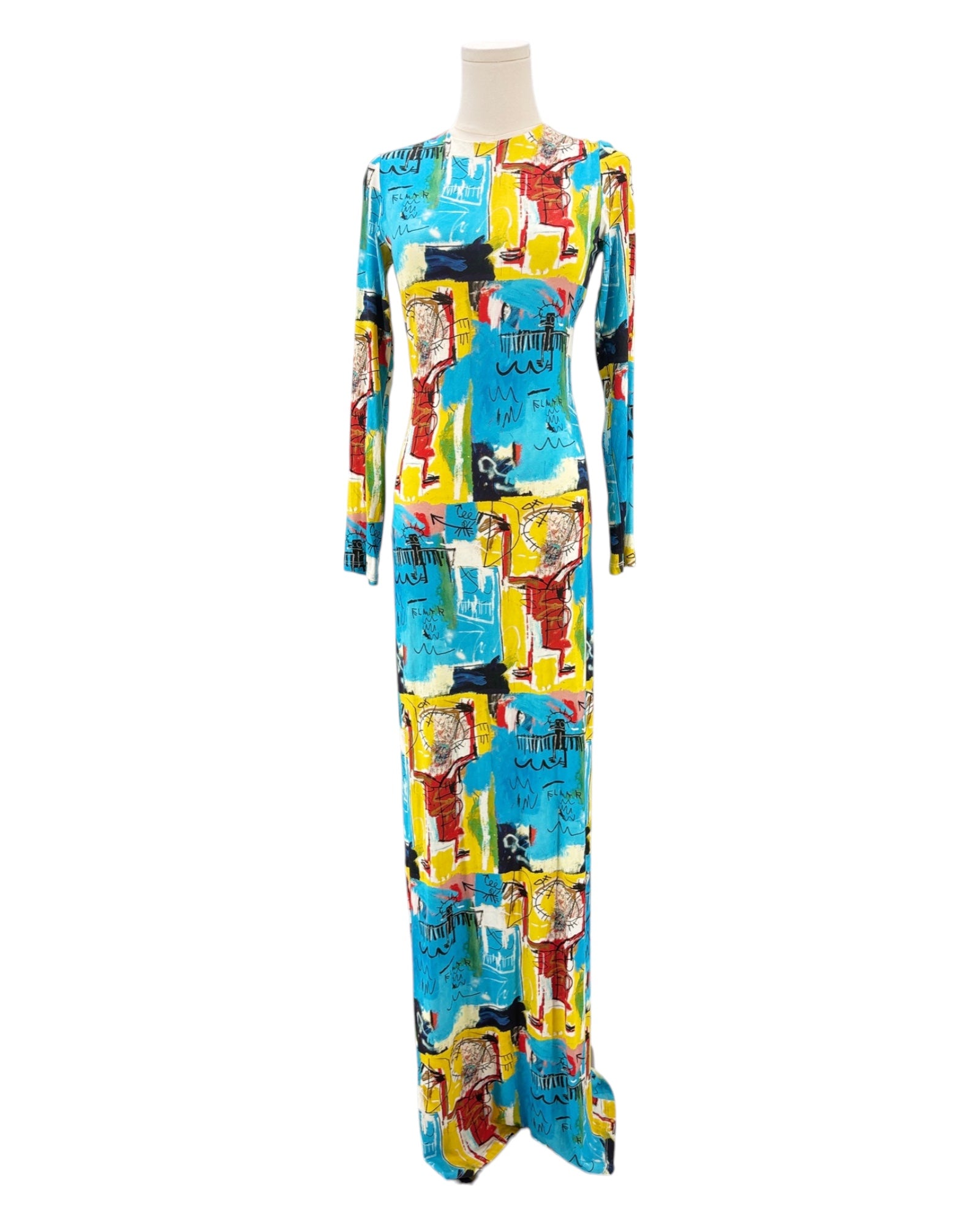 Colorful patterned dress on a mannequin against a white background
