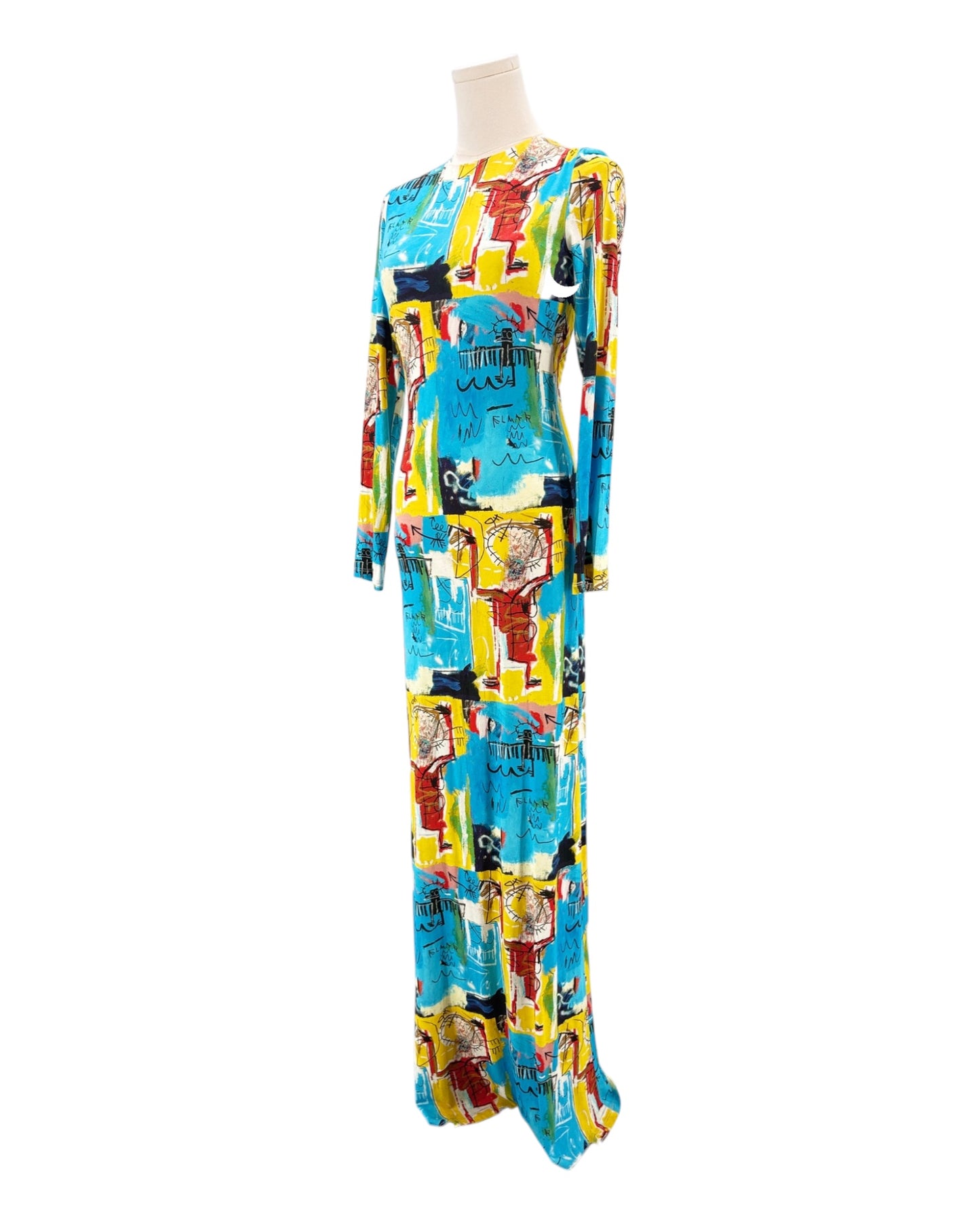 Colorful dress with graphic design on a mannequin against a white background