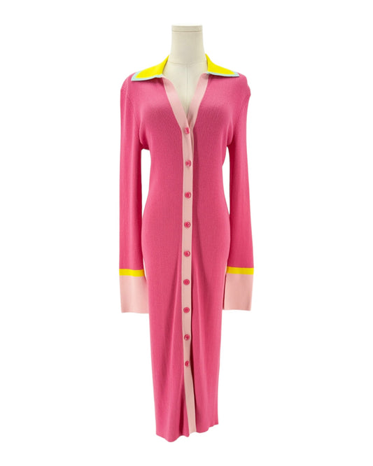 Pink ribbed long sleeve midi dress with yellow details on the collar and cuffs. On and white background on a mannequin