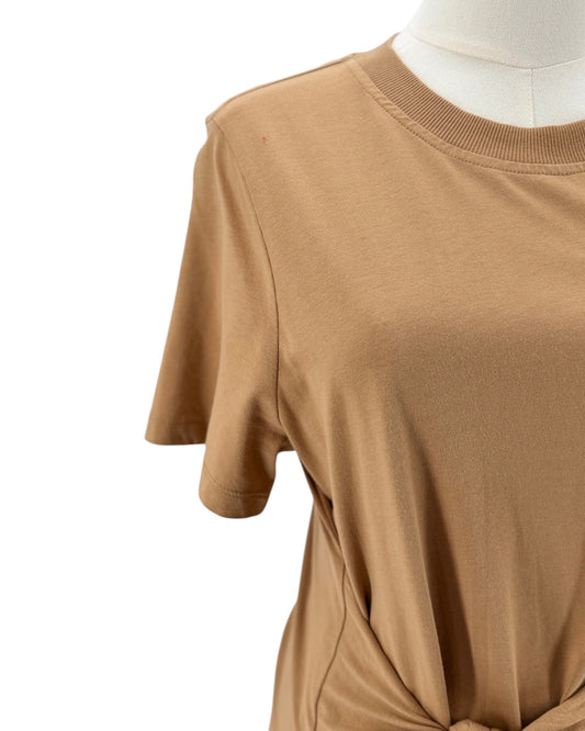 Tan dress on a mannequin against a white background