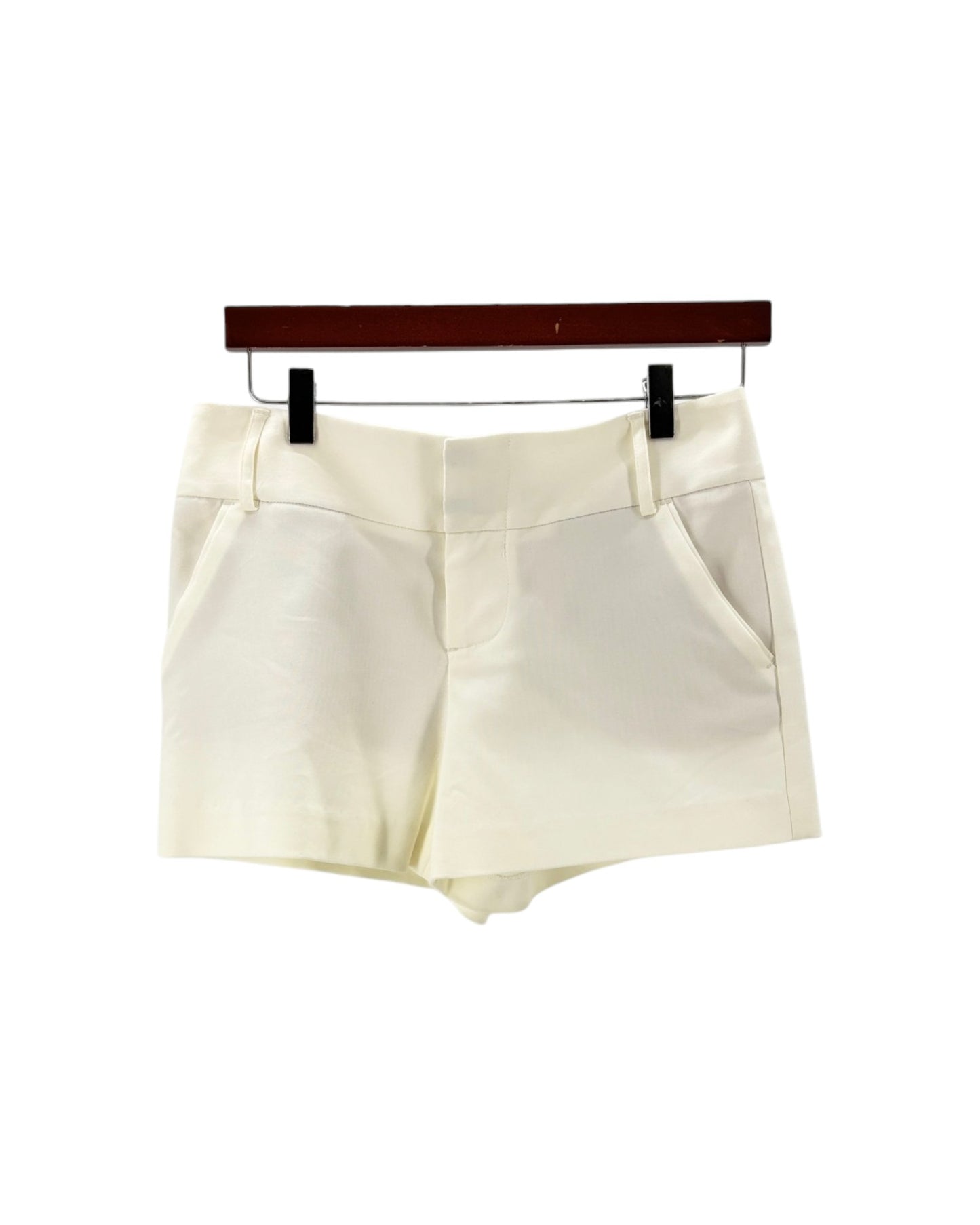 White shorts on a hanger against a white background