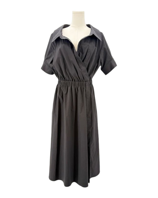 Black dress on a mannequin against a white background