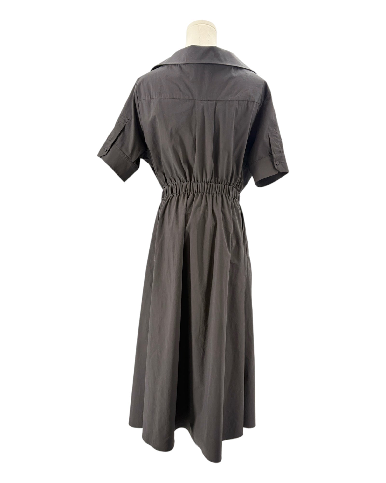 black dress on a mannequin against a white background