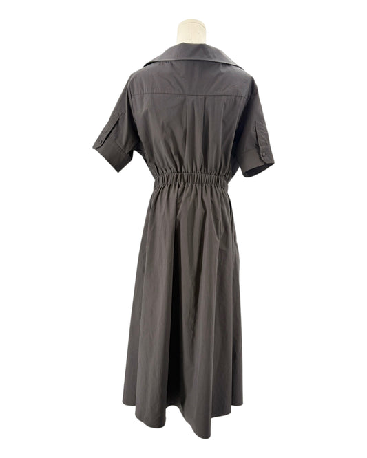 black dress on a mannequin against a white background