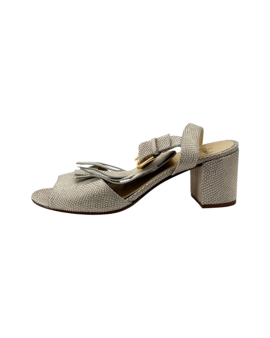 Beige high-heeled sandal on a white background