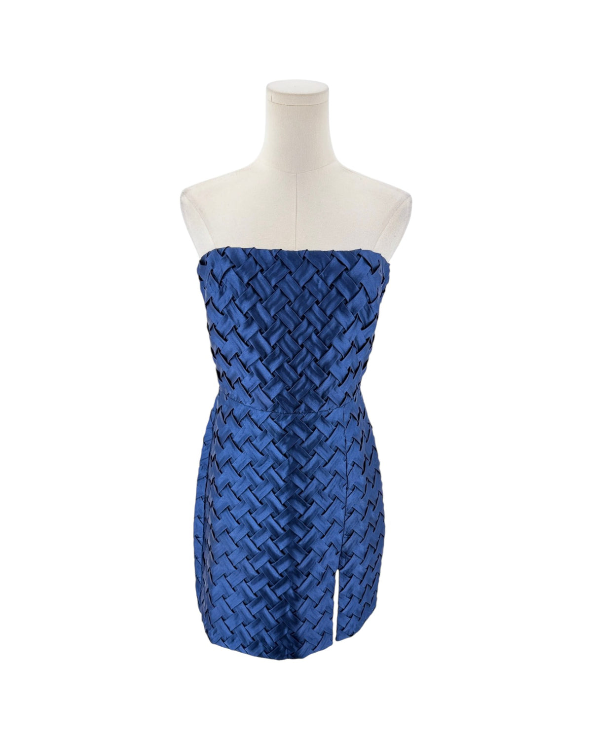 A strapless blue mini dress with a textured, woven basketweave pattern, displayed on a white mannequin torso against a plain white background.