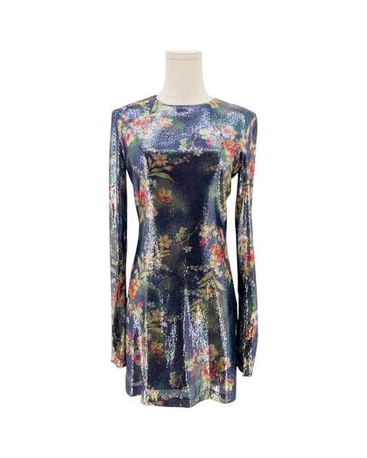A long-sleeve mini dress with a shimmering floral print on a dark navy base, displayed on a mannequin torso against a plain white background.