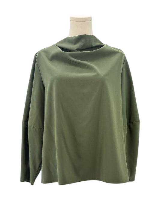 Green blouse on a mannequin against a white background