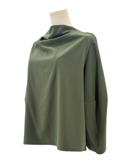 Green blouse on a mannequin against a white background
