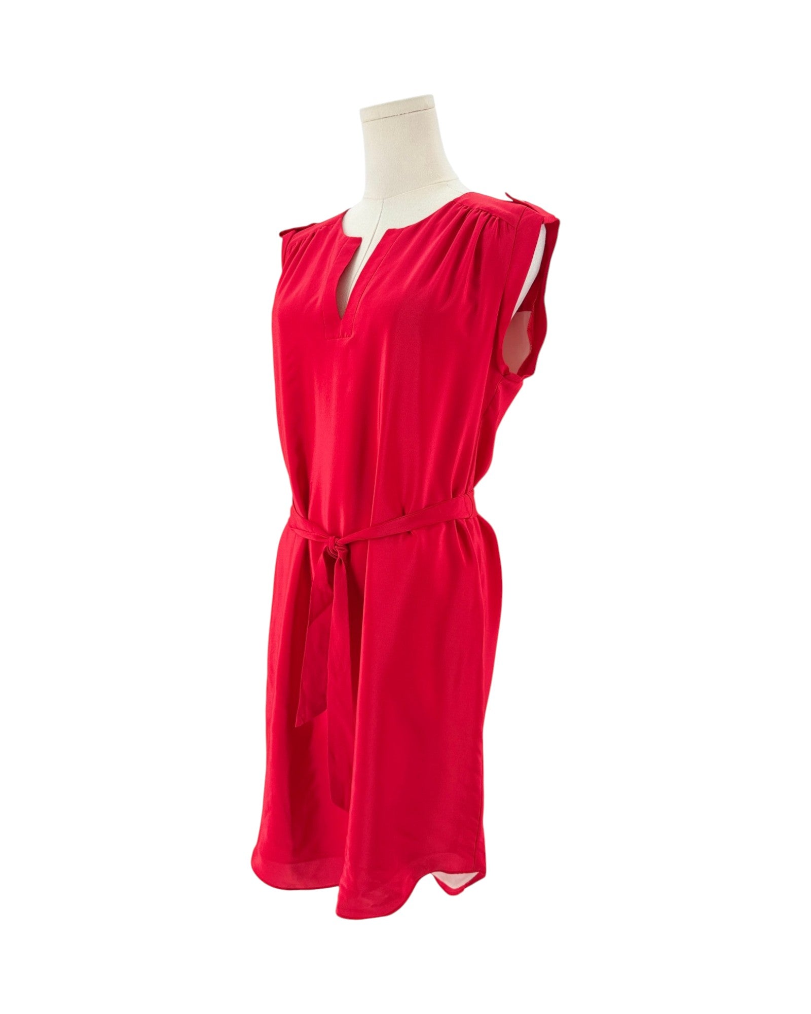 A bright red sleeveless dress displayed on a mannequin torso against a plain white background.