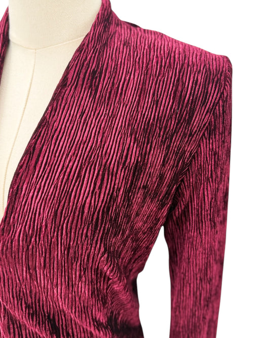 Maroon textured dress on a mannequin against a white background