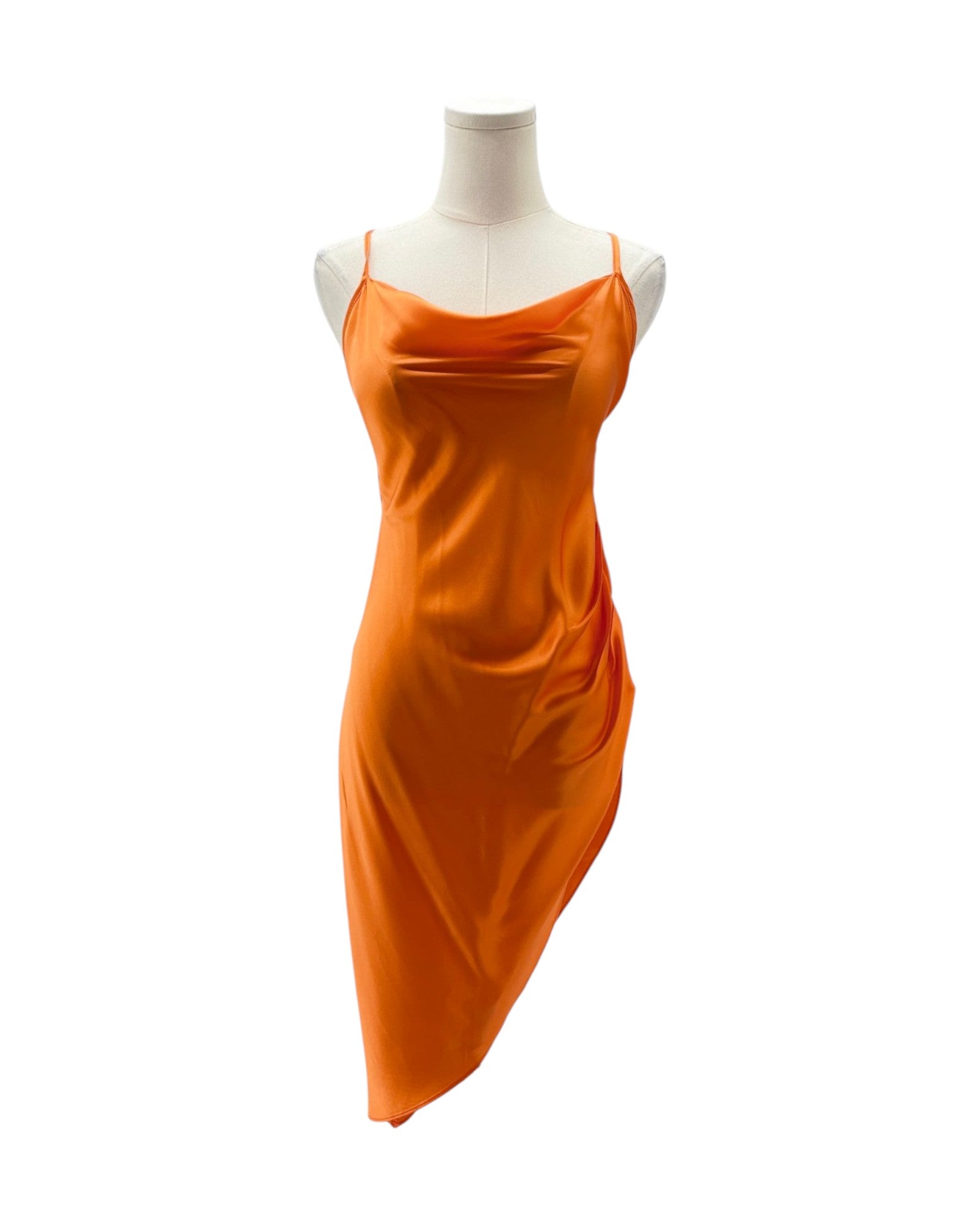Orange dress on a mannequin against a white background