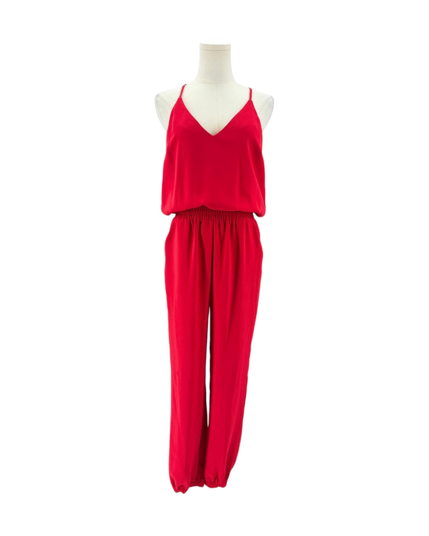 A bright red two-piece clothing set displayed on a white mannequin torso against a plain white background. The set includes a sleeveless V-neck top and matching wide-leg pants.
