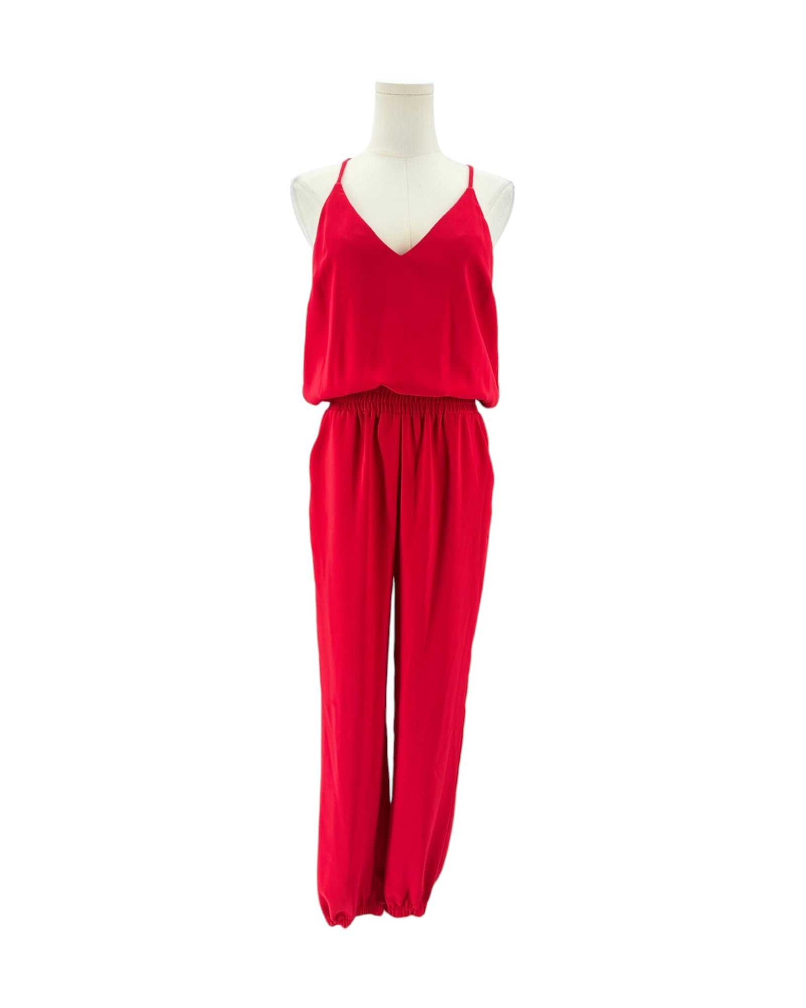 A bright red two-piece clothing set displayed on a white mannequin torso against a plain white background. The set includes a sleeveless V-neck top and matching wide-leg pants.