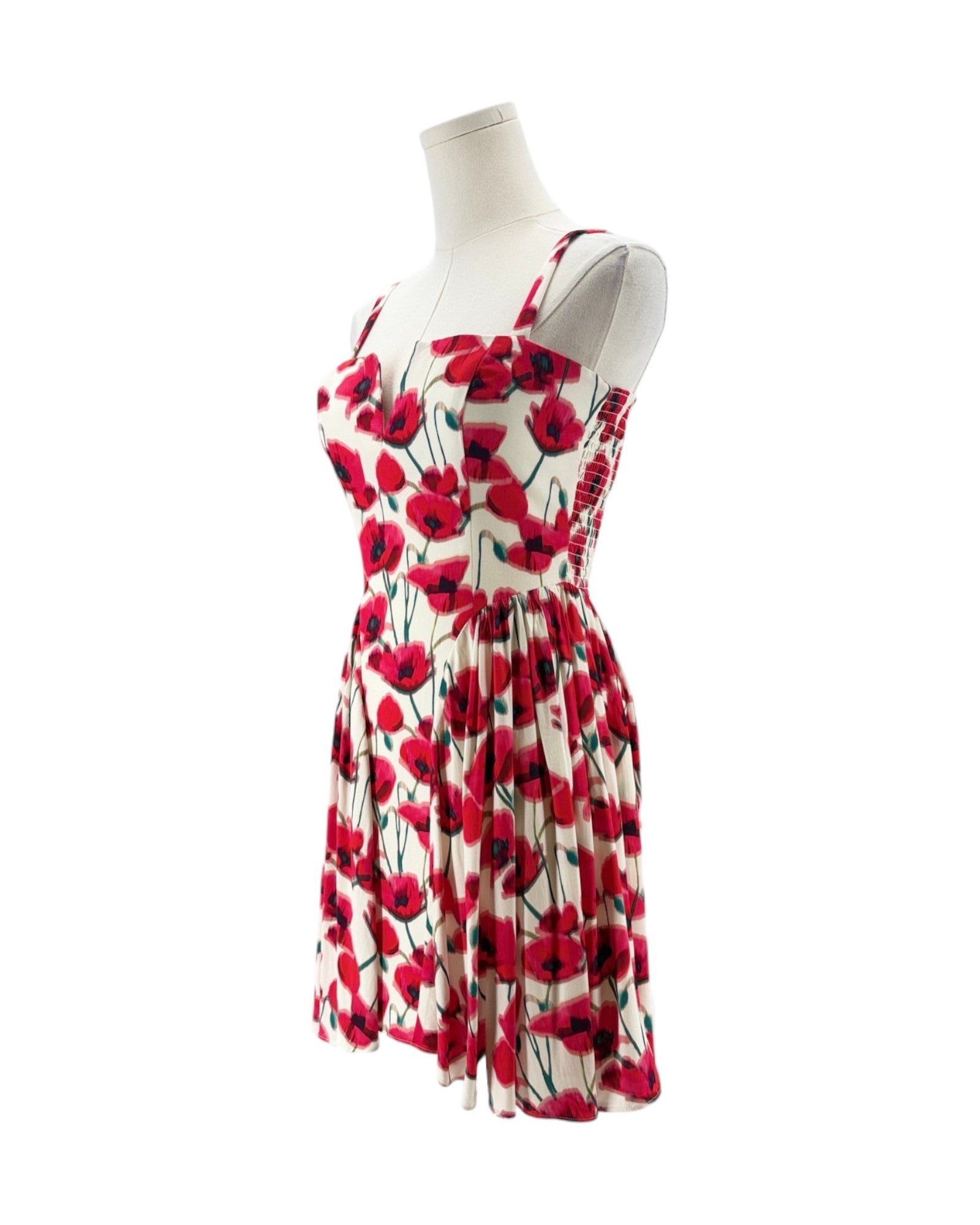 Red and black floral dress on a mannequin against a white background