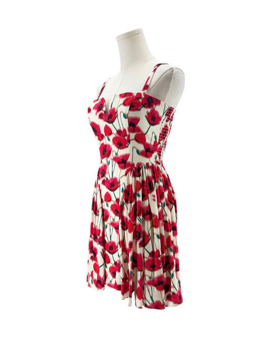 Red and black floral dress on a mannequin against a white background