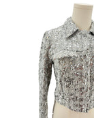 Amanda Uprichard silver sequin jacket on a mannequin against a white background