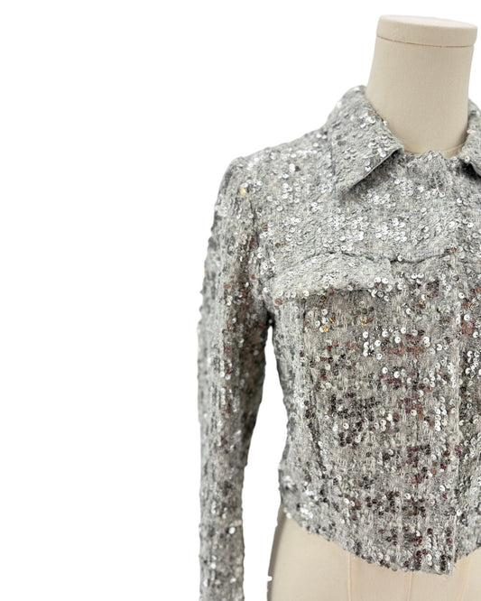 Amanda Uprichard silver sequin jacket on a mannequin against a white background