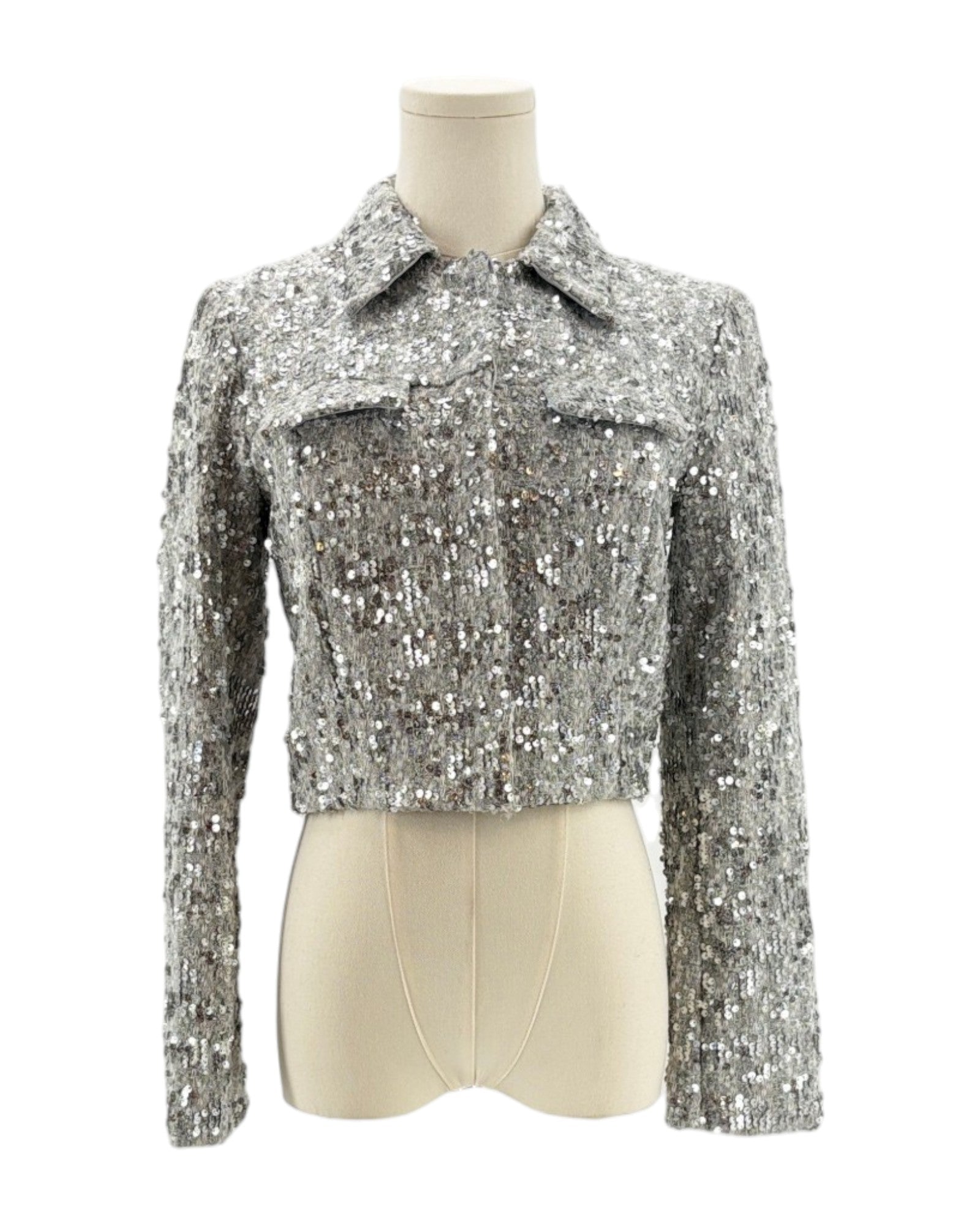 Amanda Uprichard silver sequin jacket on a mannequin against a white background