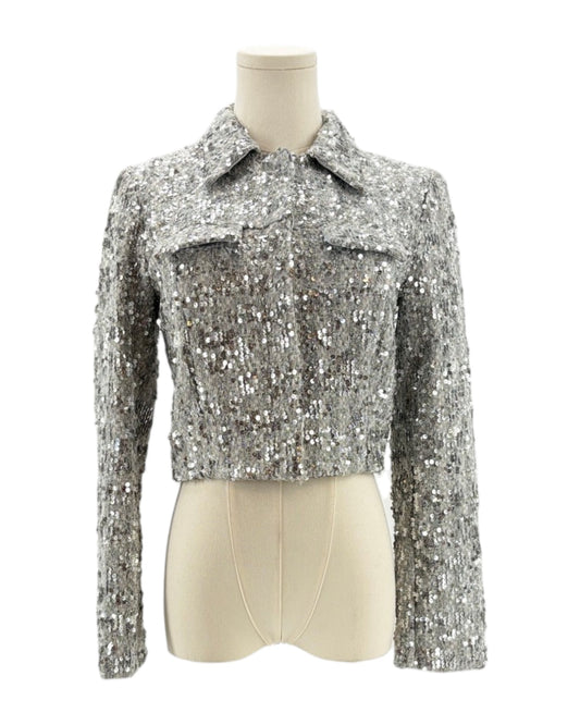 Amanda Uprichard silver sequin jacket on a mannequin against a white background