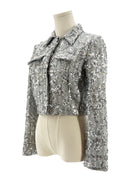 Amanda Uprichard silver sequin jacket on a mannequin against a white background