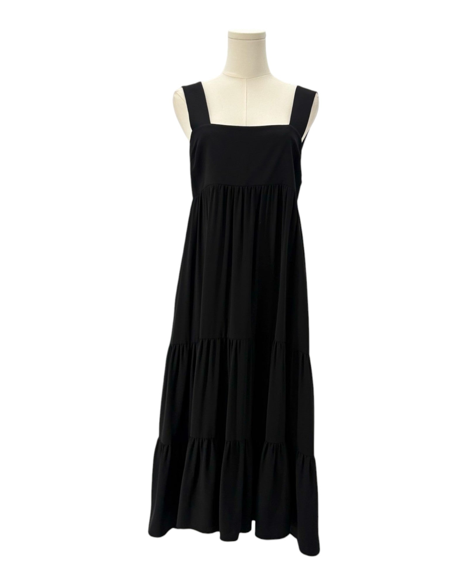 Amanda Uprichard black dress on a mannequin against a white background