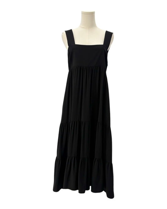 Amanda Uprichard black dress on a mannequin against a white background