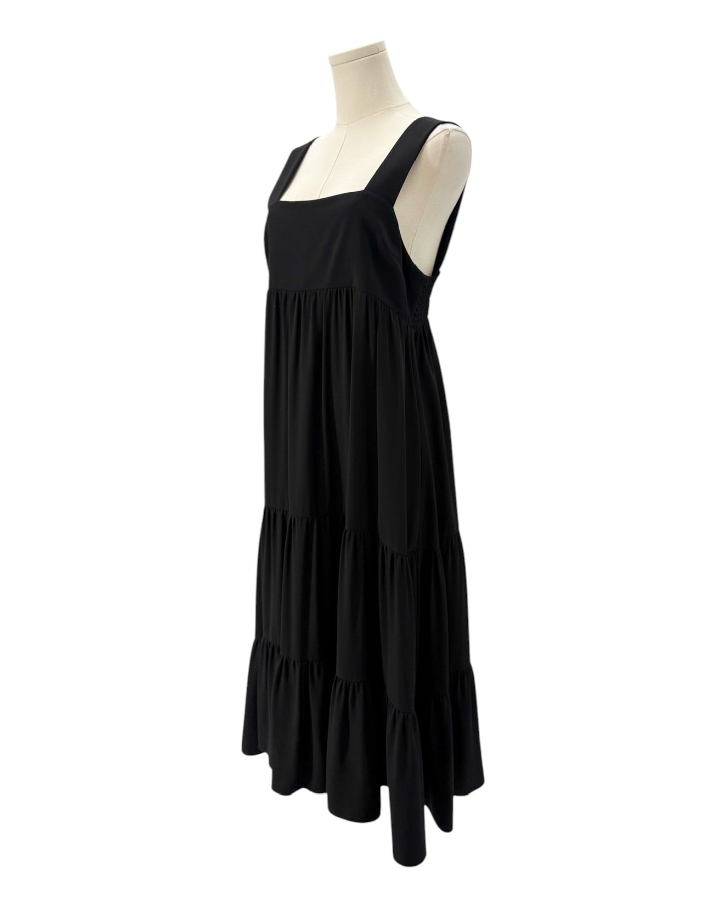 Amanda Uprichard black dress on a mannequin against a white background