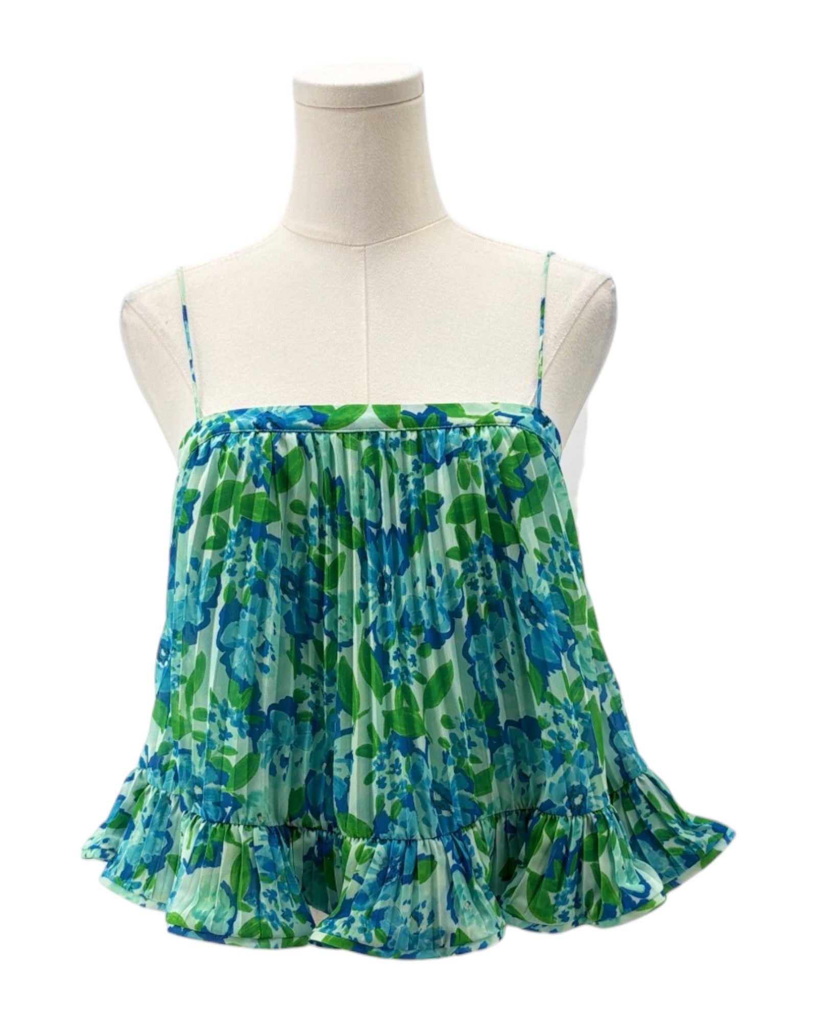 Green and blue patterned dress on a mannequin against a white background