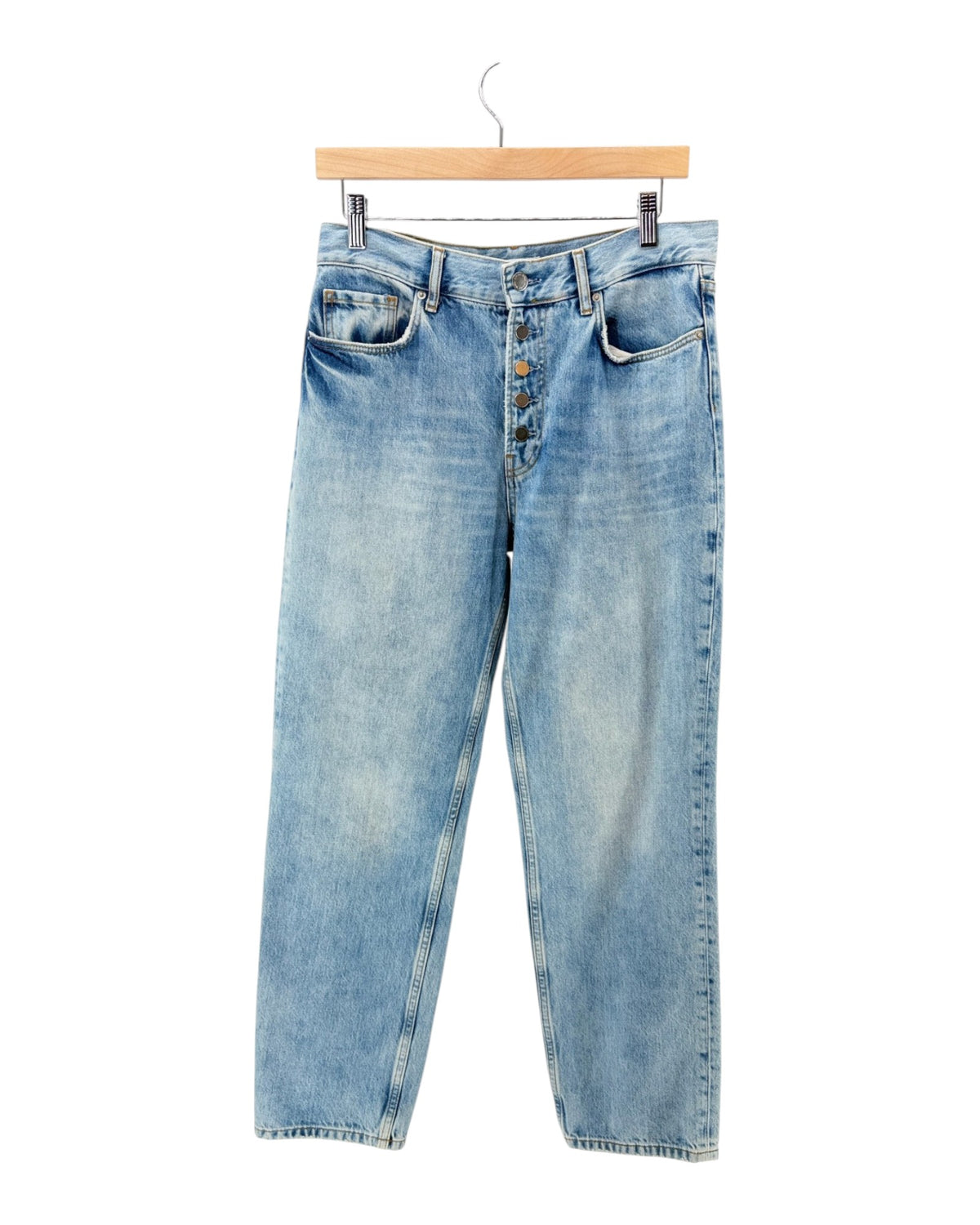 Denim jeans with a button fly on a white background