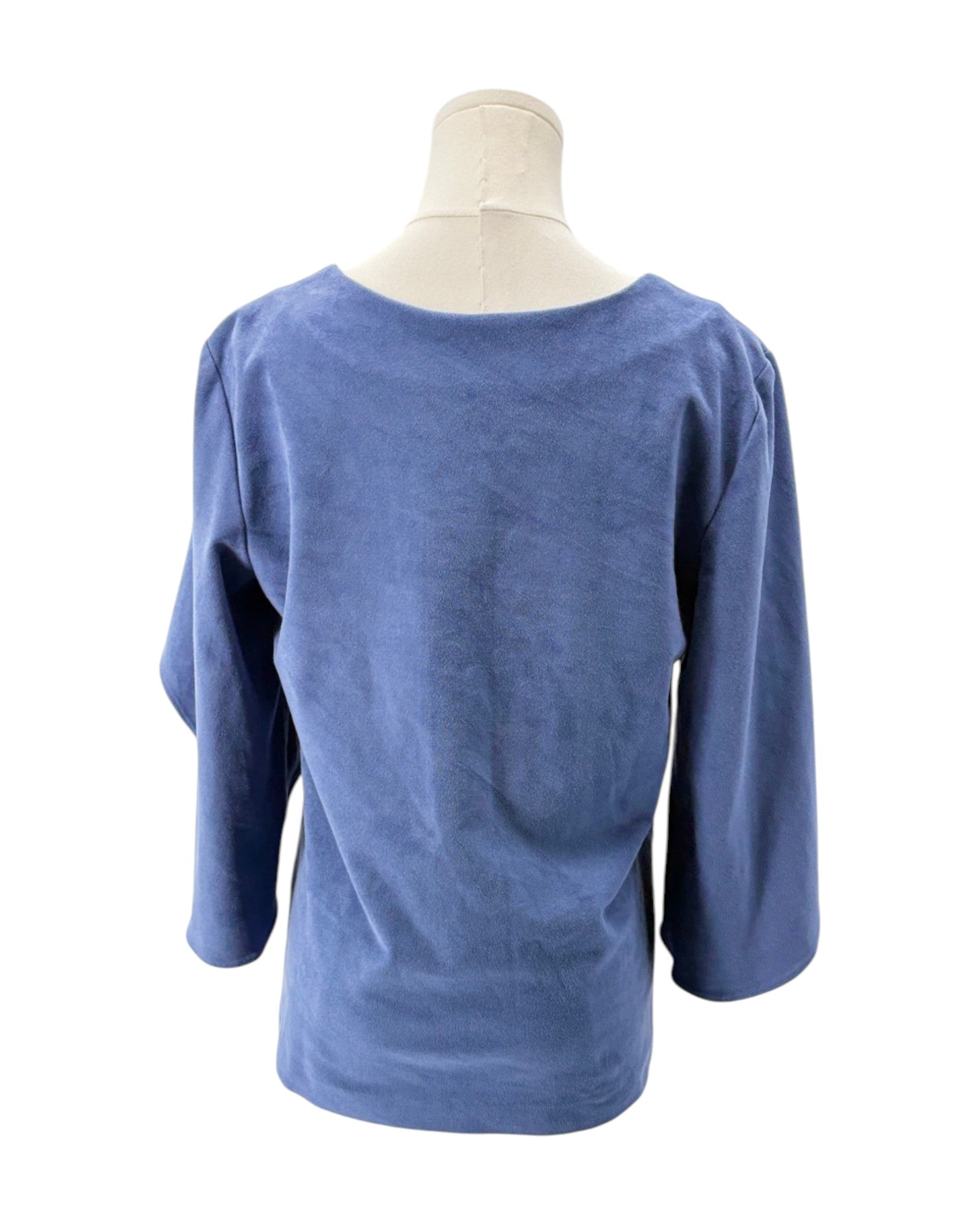 Blue blouse on a mannequin against a white background
