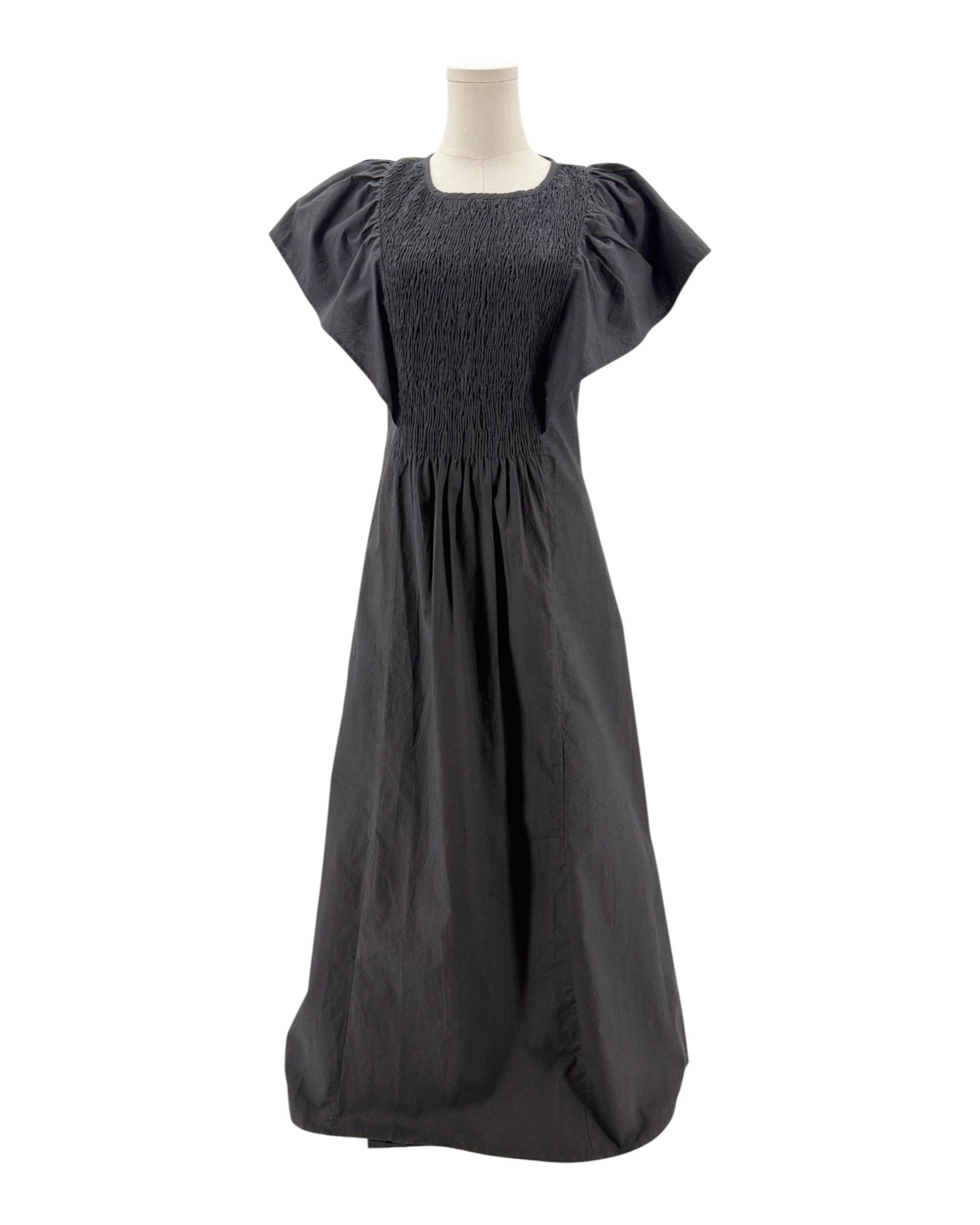 Black dress on a mannequin against a white background