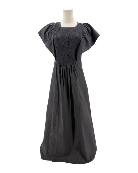 Black dress on a mannequin against a white background