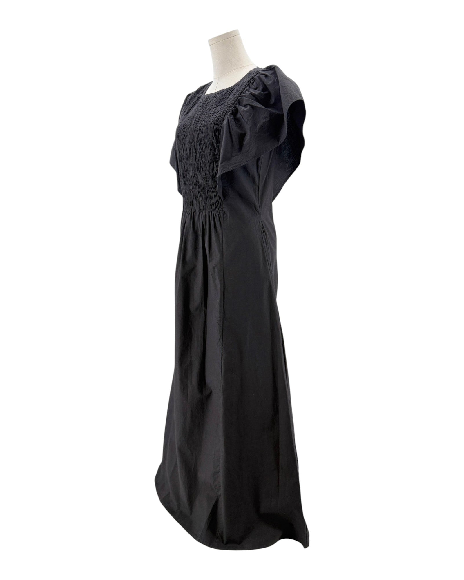 Black dress on a mannequin against a white background