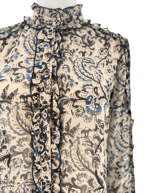 Long sleeve, front button down blouse, paisley and floral block print, ruffle details throughout on a mannequin on a white background
