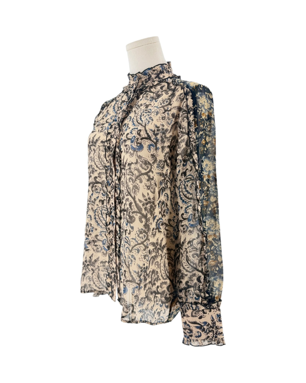 Long sleeve, front button down blouse, paisley and floral block print, ruffle details throughout on a mannequin on a white background