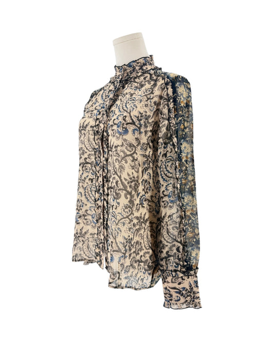 Long sleeve, front button down blouse, paisley and floral block print, ruffle details throughout on a mannequin on a white background