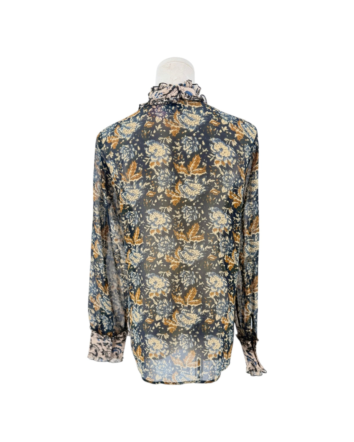 Long sleeve, front button down blouse, paisley and floral block print, ruffle details throughout on a mannequin on a white background