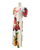 Mannequin wearing a colorful floral dress on a white background