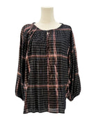 Apiece Apart metallic plaid shirt on a mannequin against a white background