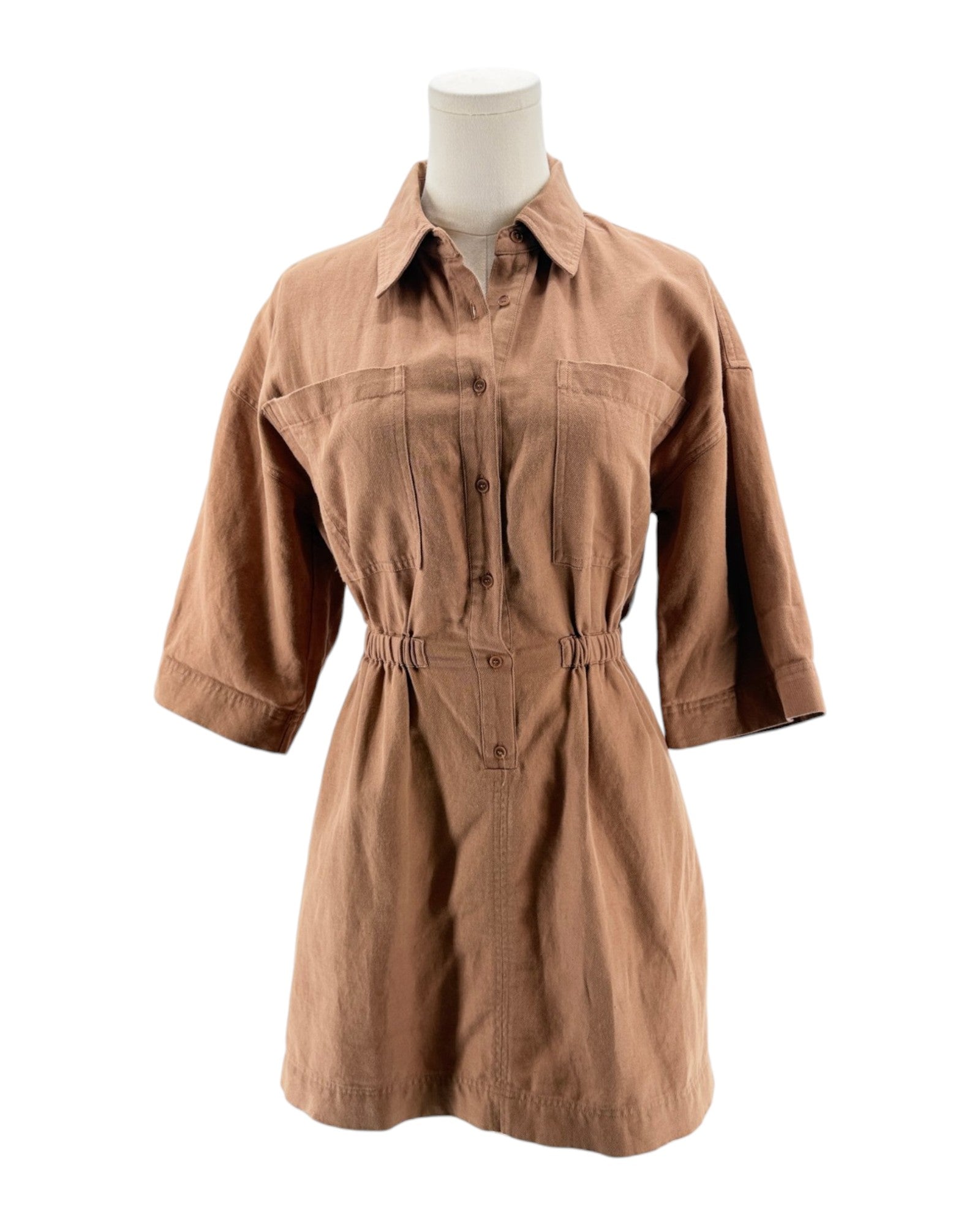 Brown dress on a mannequin against a white background