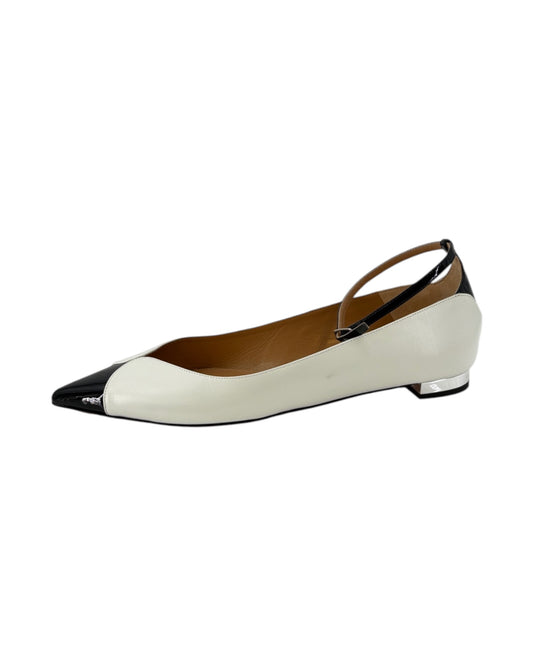 Two-tone shoe with black and white design on a white background